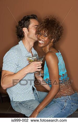 Flirtatious couple with cocktails View Large Photo Image Stock Image - Flirtatious couple with cocktails. Fotosearch