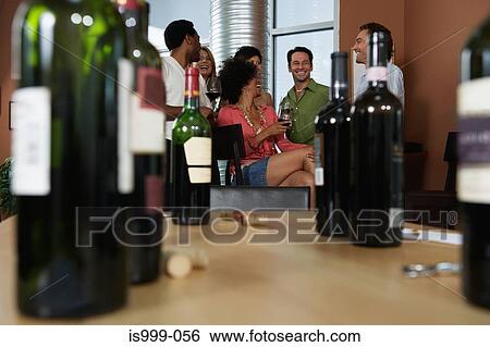 Friends at a wine party View Large Photo Image Stock Photograph - Friends at a wine party. Fotosearch