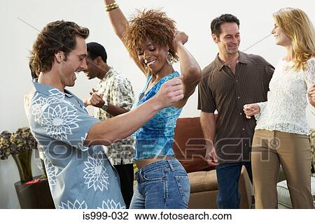 Friends dancing at a party View Large Photo Image Stock Image - Friends dancing at a party. Fotosearch