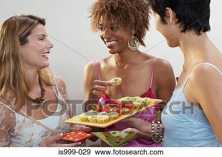 Friends having canapes View Large Photo Image Stock Photo - Friends having canapes. Fotosearch