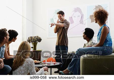 Friends playing charades View Large Photo Image Stock Photo - Friends playing charades. Fotosearch
