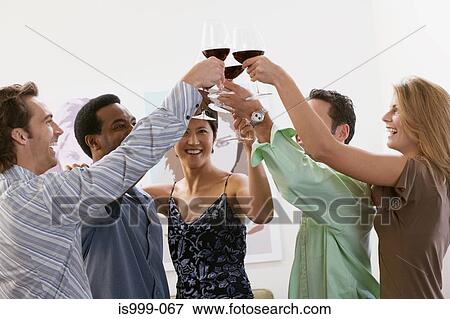 Friends raising a toast View Large Photo Image Stock Photo - Friends raising a toast. Fotosearch