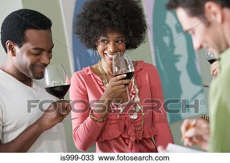 Friends wine tasting View Large Photo Image Stock Image - Friends wine tasting. Fotosearch