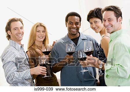 Friends wine tasting View Large Photo Image Stock Photo - Friends wine tasting. Fotosearch