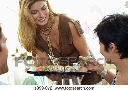 Hostess offering canapes View Large Photo Image Stock Image - Hostess offering canapes. Fotosearch