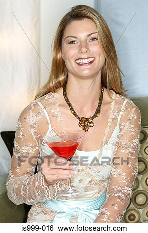 Stock Photograph - Woman with a cocktail. Fotosearch