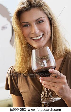 Stock Image - Woman with a glass of wine. Fotosearch