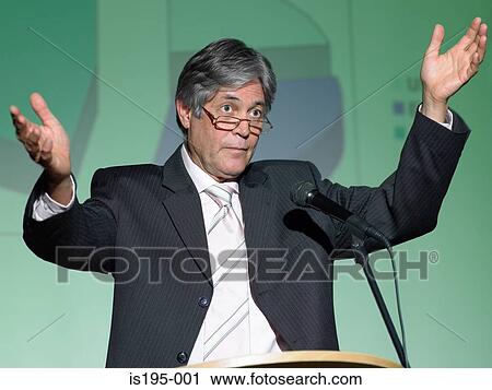Businessman giving a speech View Large Photo Image Stock Image - Businessman giving a speech. Fotosearch