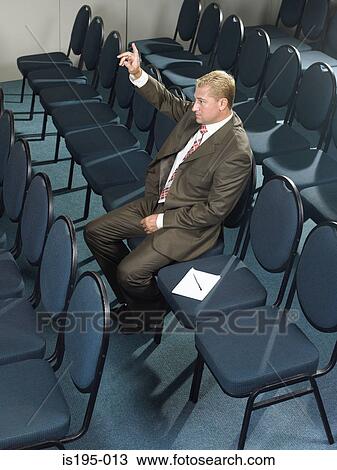 Businessman listening to presentation View Large Photo Image Stock Image - Businessman listening to presentation. Fotosearch