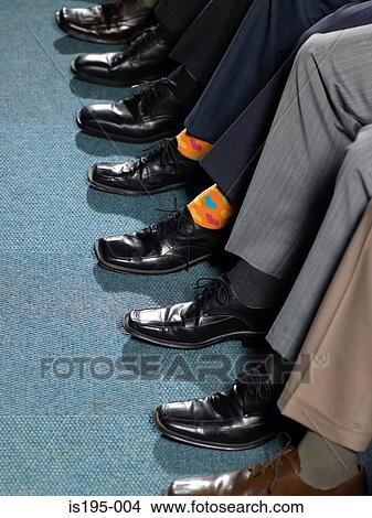 Businessman sitting in a row View Large Photo Image Picture - Businessman sitting in a row. Fotosearch