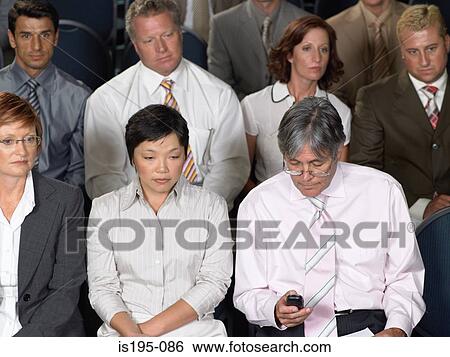 Businessman writing a text message View Large Photo Image Stock Photograph - Businessman writing a text message. Fotosearch