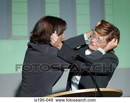Stock Photo - Businesswomen fighting. Fotosearch