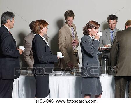 Office workers having a coffee break View Large Photo Image Stock Image - Office workers having a coffee break. Fotosearch