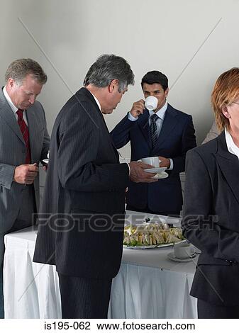 Office workers having a coffee break View Large Photo Image Stock Image - Office workers having a coffee break. Fotosearch