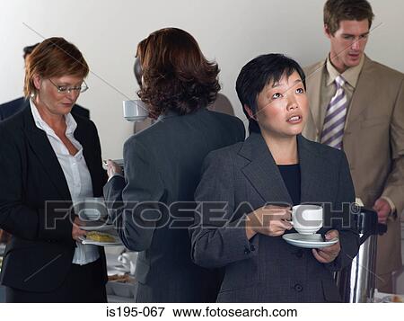 Office workers having a coffee break View Large Photo Image Stock Photo - Office workers having a coffee break. Fotosearch