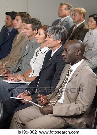 Office workers listening to a speech View Large Photo Image Stock Image - Office workers listening to a speech. Fotosearch