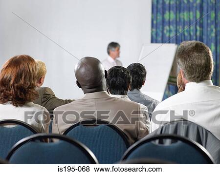 Office workers listening to a speech View Large Photo Image Stock Photo - Office workers listening to a speech. Fotosearch