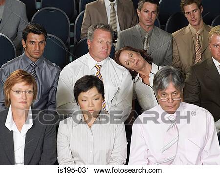 Stock Image - Office workers watching a presentation. Fotosearch