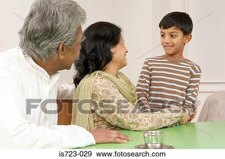 Grandparents with grandson View Large Photo Image Stock Photo - Grandparents with grandson. Fotosearch