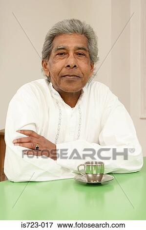 Stock Photo - Senior man with a cup of tea. Fotosearch