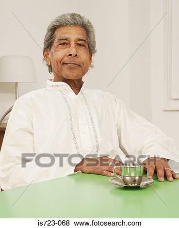 Senior man with a cup of tea View Large Photo Image Stock Photo - Senior man with a cup of tea. Fotosearch