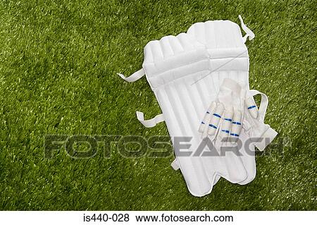 Cricket gloves and shin pads View Large Photo Image Stock Photo - Cricket gloves and shin pads. Fotosearch