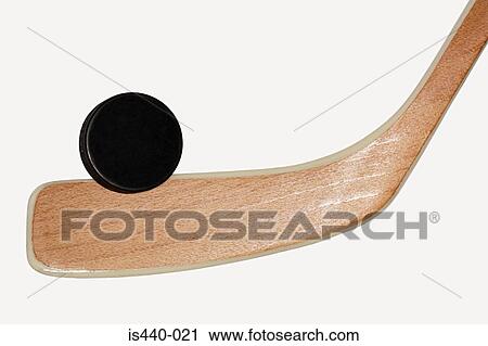 Stock Image - Ice hockey stick and puck. Fotosearch