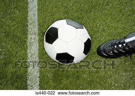 Kicking football View Large Photo Image Stock Image - Kicking football. Fotosearch
