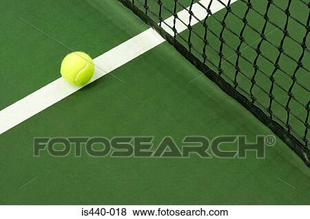 Tennis ball on court View Large Photo Image Stock Photo - Tennis ball on court. Fotosearch