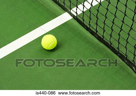 Tennis ball on court View Large Photo Image Stock Photograph - Tennis ball on court. Fotosearch