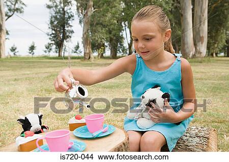 Girl having a tea party with soft toys View Large Photo Image Picture - Girl having a tea party with soft toys. Fotosearch