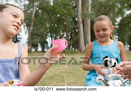 Girls having a tea party View Large Photo Image Stock Image - Girls having a tea party. Fotosearch