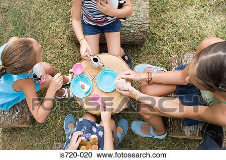 Girls having a tea party View Large Photo Image Stock Image - Girls having a tea party. Fotosearch