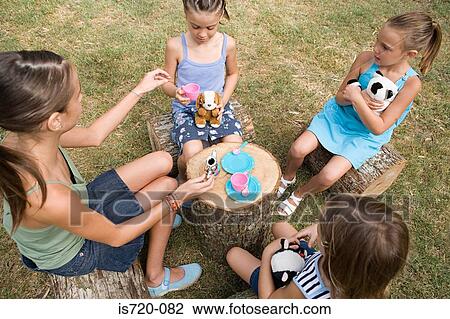 Girls having a tea party View Large Photo Image Stock Image - Girls having a tea party. Fotosearch