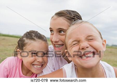 Girls making faces View Large Photo Image Stock Photo - Girls making faces. Fotosearch