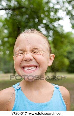 Stock Photo - Grimacing girl. Fotosearch