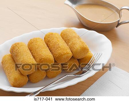 Croquettes and gravy View Large Photo Image Stock Image - Croquettes and gravy. Fotosearch