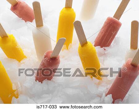 Ice lollies in ice View Large Photo Image Stock Image - Ice lollies in ice. Fotosearch