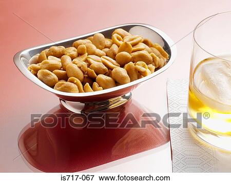 Stock Photo - Peanuts and a drink. Fotosearch