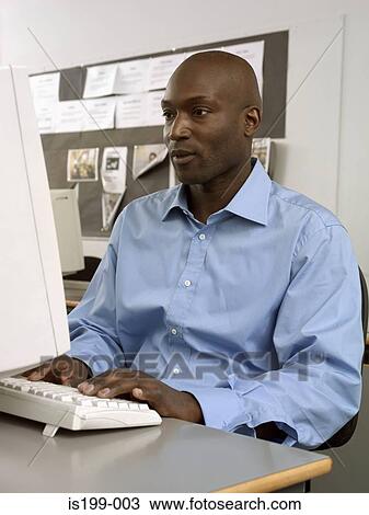 Stock Image - Mature student using computer. Fotosearch