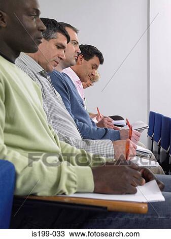 Stock Image - Mature students in a lecture. Fotosearch