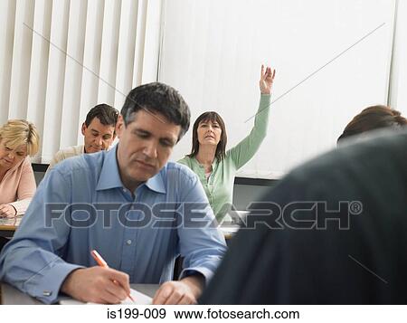 Stock Photo - Mature students in a lesson. Fotosearch