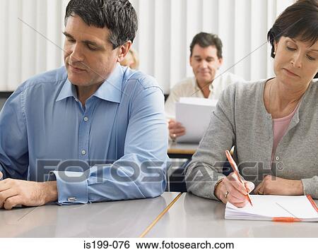 Mature students in a lesson View Large Photo Image Stock Photograph - Mature students in a lesson. Fotosearch