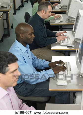 Mature students using computers View Large Photo Image Stock Photo - Mature students using computers. Fotosearch
