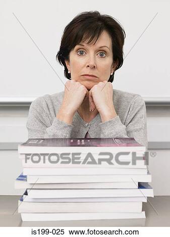Teacher looking bored View Large Photo Image Stock Photography - Teacher looking bored. Fotosearch