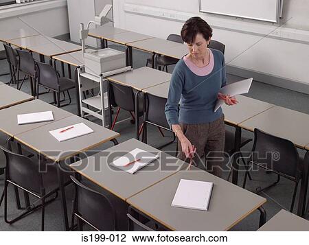 Stock Image - Teacher preparing for a class. Fotosearch