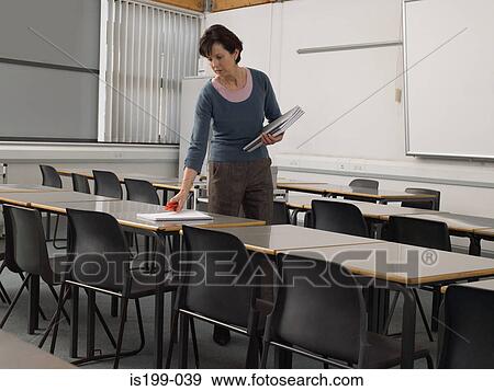 Stock Photo - Teacher preparing for a class. Fotosearch