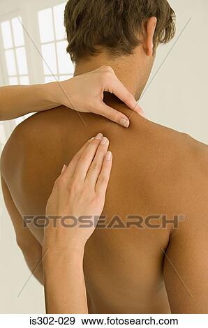 Stock Photo - Man having his back massaged. Fotosearch