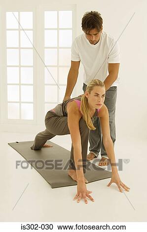 Man helping woman stretch View Large Photo Image Stock Image - Man helping woman stretch. Fotosearch