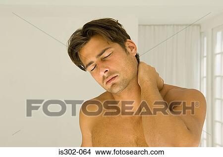 Man rubbing his neck View Large Photo Image Picture - Man rubbing his neck. Fotosearch